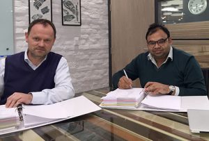 ilman Helmer, Area Sales Manager for Dieffenbacher and Shobhan Mittal, Joint Managing Director and CEO of Greenply Industries Limited during the signing of the contract